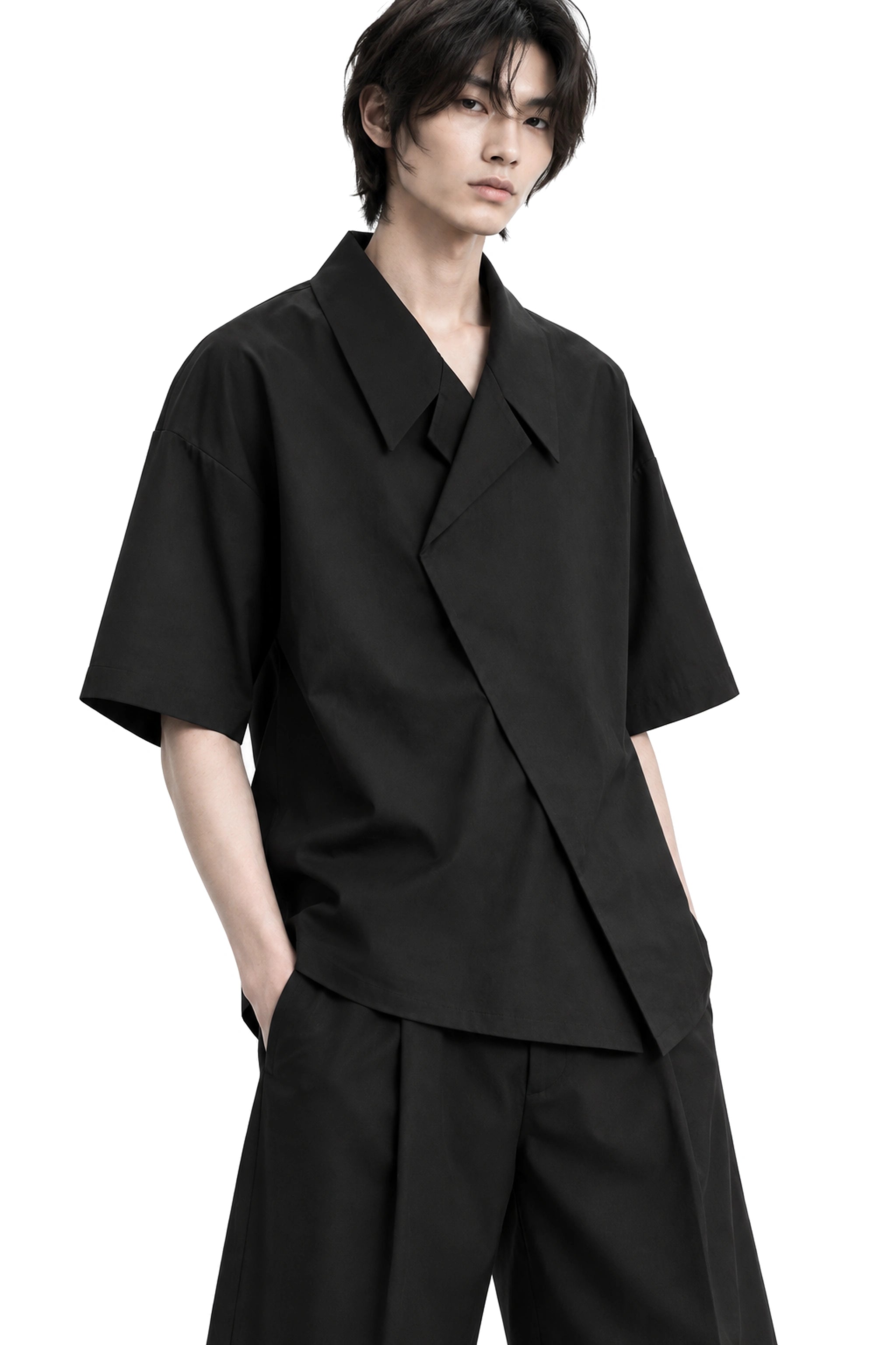 The Wrap Shirt three-quarter silhouette and architectural drape